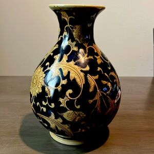 Dark blue glass vase with gold floral print